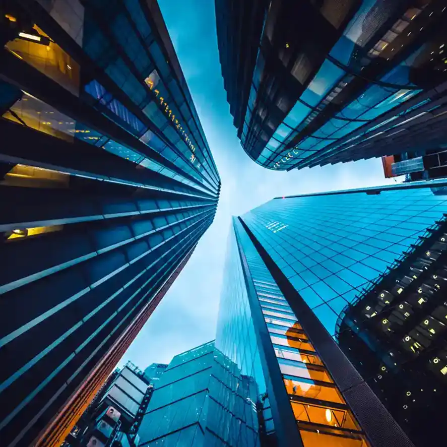 Looking up at buildings in CBD with dark blue sky